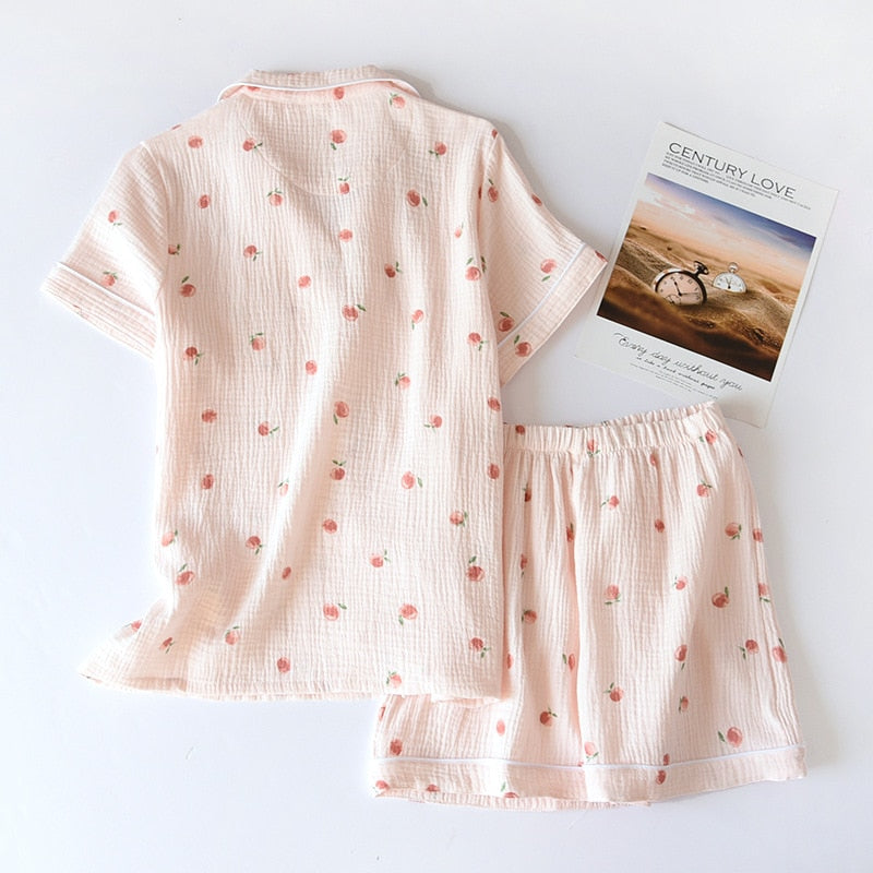 pyjama rose de dos avec motif pêche sur fond blanc